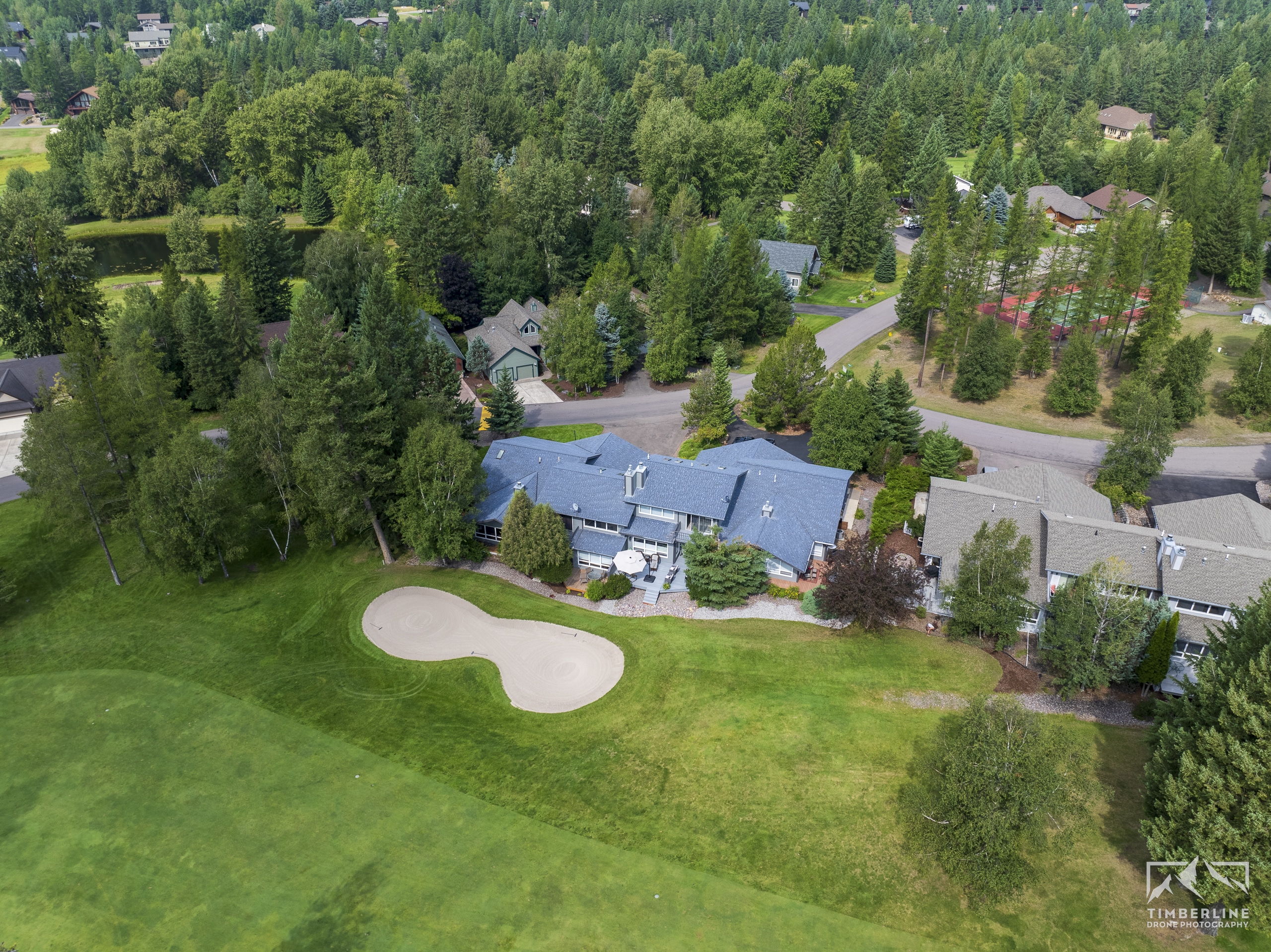 Aerial drone photo of a home on Meadow Lake golf course in Columbia Falls, MT